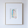 Framed abstract artwork with colorful design on a white wall
