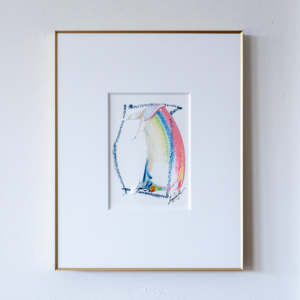 Abstract painting in slim gold frame on white wall