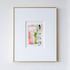 Framed abstract acrylic and oil pastel painting on a white wall