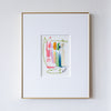 Framed artwork of colorful abstract painting on a white wall