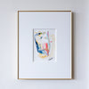 Framed abstract painting on a white wall