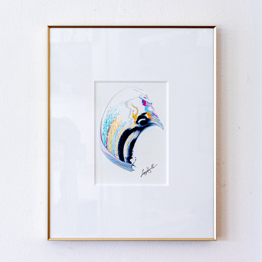 A framed original abstract painting set against a white mat and a thin gold frame, mounted on a white wall.