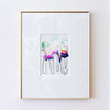 A framed abstract art print featuring colorful brushstrokes and black line drawings, presented in a white mat and a thin gold frame against a white wall.