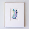 A framed abstract painting, displayed in a white mat with a thin gold frame against a light gray wall.
