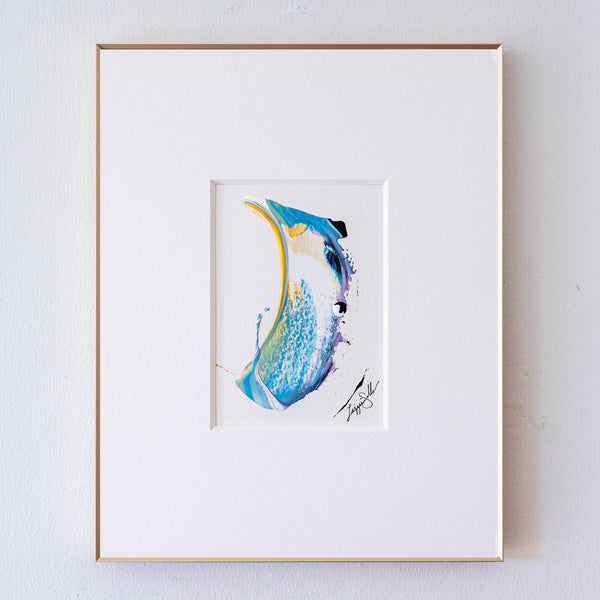 A framed acrylic painting, featuring a wide white mat board and a thin gold frame, mounted on a light gray textured wall.