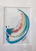 A framed abstract painting featuring a curved swish in shades of teal, coral and metallic gold, set within a white mat.