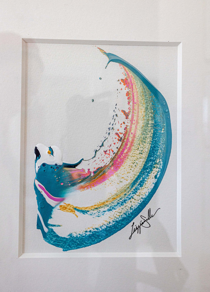 A framed abstract painting featuring a curved swish in shades of teal, coral and metallic gold, set within a white mat.