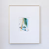A framed abstract painting featuring green, blue, gold, and black brushstrokes, presented in a white mat and a thin gold frame against a white wall.