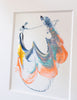 A framed abstract painting featuring blue, coral, blue, gold, and black in a white mat.