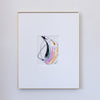 A framed abstract painting featuring fluid, acrylic in black, pink, metallic gold and green with black oil pastel markings in a white mat, enclosed in a thin gold frame against a light gray wall.