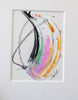 A framed abstract painting featuring fluid, acrylic in black, pink, metallic gold and green with black oil pastel markings in a white mat.