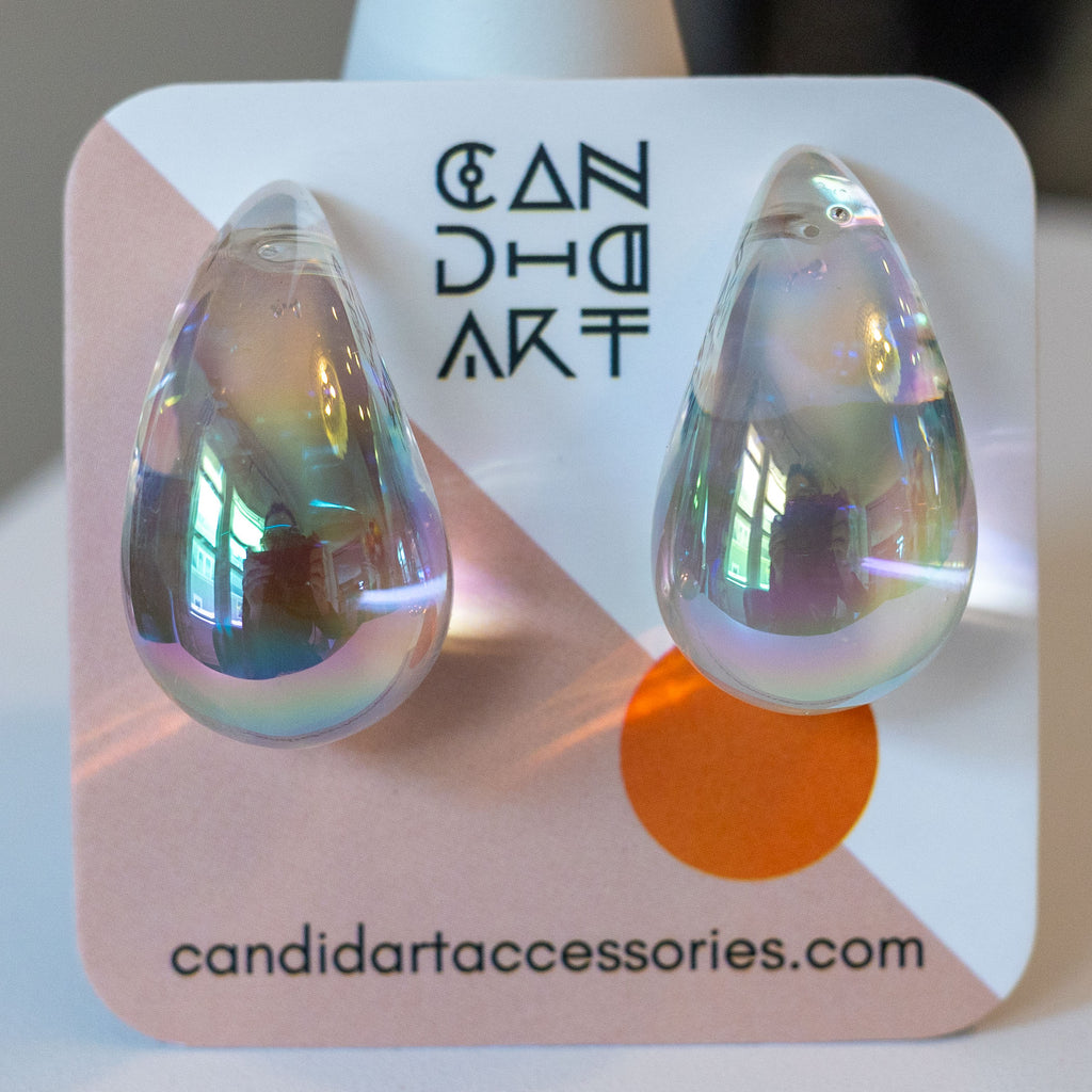 Iridescent teardrop earrings on a branded card with 'candidart' branding.