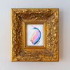Decorative gold frame with a colorful abstract painting inside on a light gray background