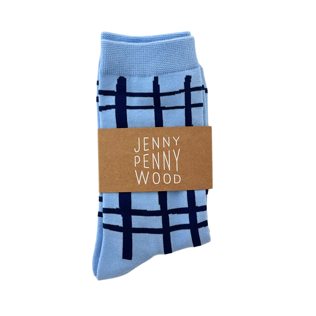 Light blue socks with dark blue plaid pattern and 'Jenny Penny Wood' label on a white background
