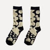 Pair of socks with black and white abstract pattern on a gradient background