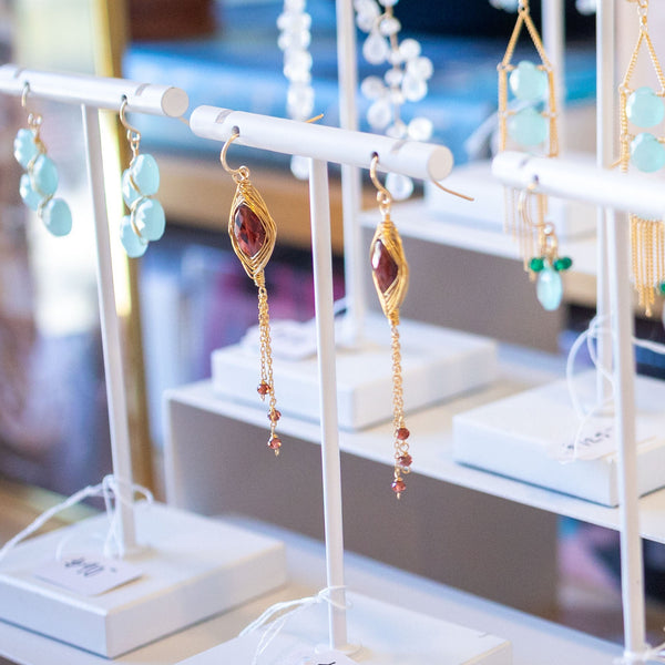 Display of earrings on stands in a store setting