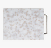 Marble-patterned cutting board with a metal handle on a white background