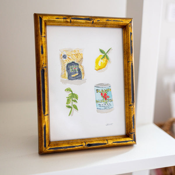 Framed artwork with illustrations on a white surface
