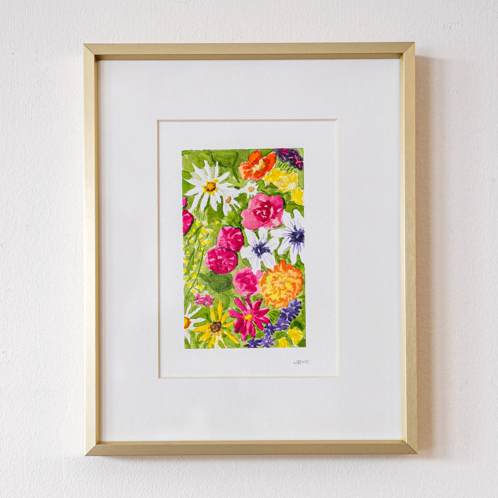 Framed floral artwork on a white wall
