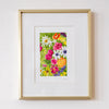 Framed floral artwork on a white wall