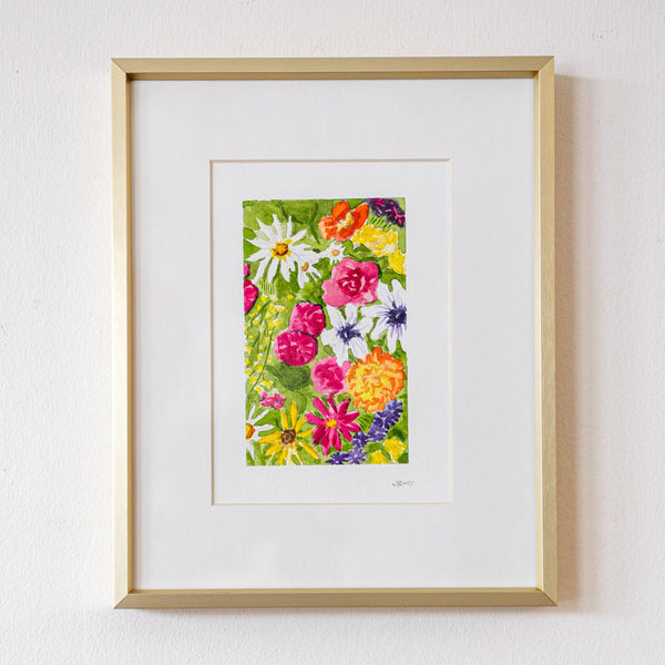 Framed floral artwork on a white wall