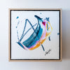 Framed abstract painting with colorful brush strokes on a white background