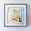 Framed abstract artwork with colorful design on a white background