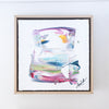 Framed abstract artwork with colorful brush strokes on a white background