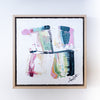 Framed abstract artwork with colorful design on a white background