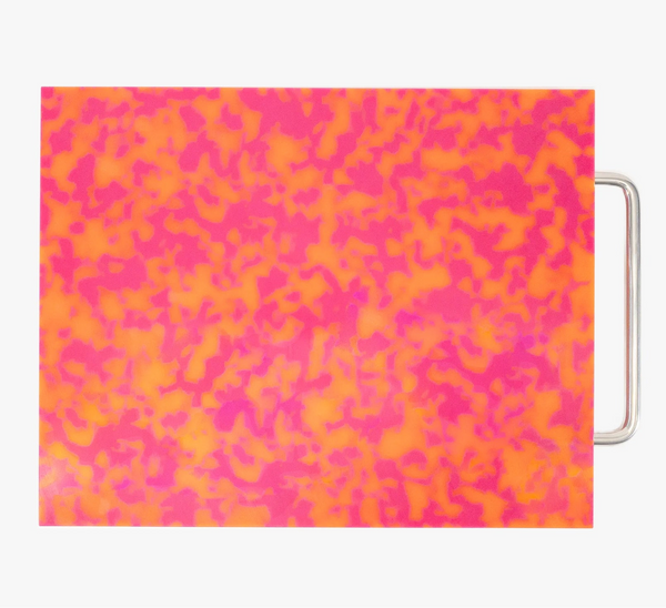 cutting board with pink and orange abstract pattern on a white background