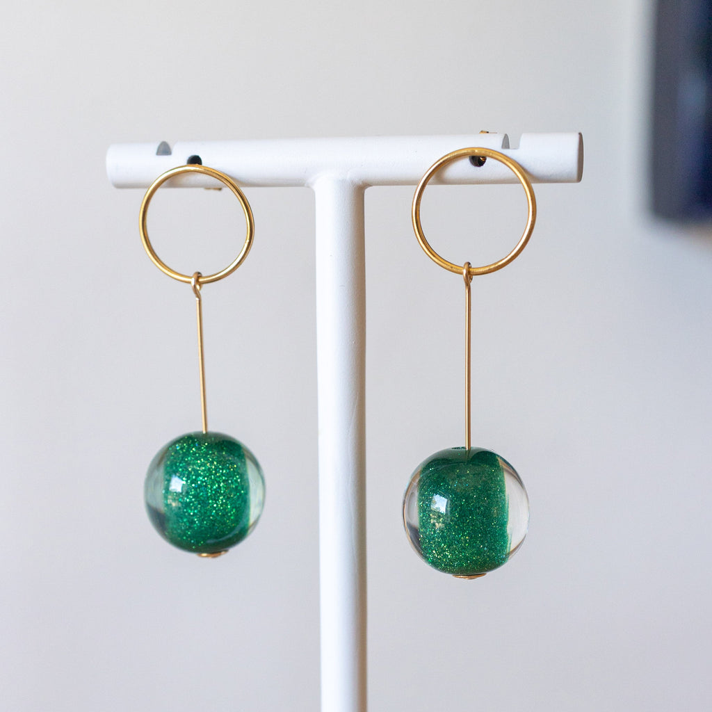 Gold drop earrings with sparkly emerald vintage lucite balls