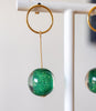 close up of sparkly green earring