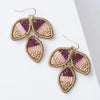 Pair of earrings with leaf-shaped design on a white background