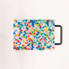 Confetti colored cutting board with black handle