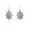 A pair of gold drop earrings featuring oval light pink gemstones in a six-prong setting, suspended from gold hooks against a plain white background.