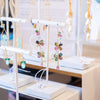 Display of earrings on stands in a store setting