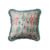 Decorative pillow with floral pattern and frayed edges on a white background