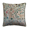 Decorative pillow with intricate patterns and animals on a white background